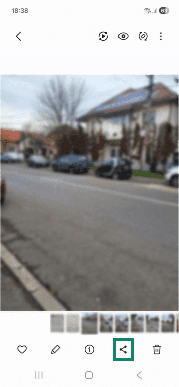 A photo in an Android phone's gallery. The share icon at the bottom is highlighted.