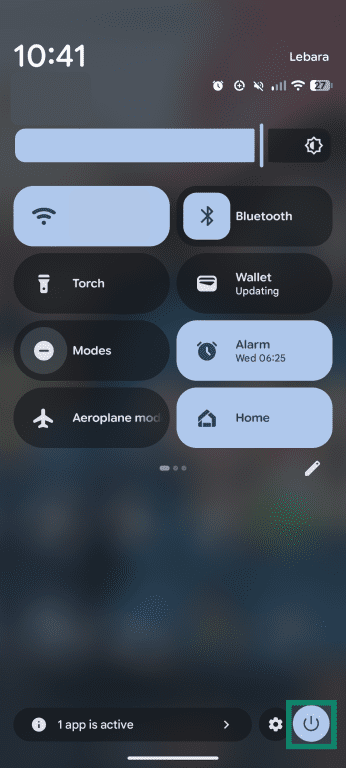 An Android Quick Settings panel with the power icon highlighted in the bottom-right corner.